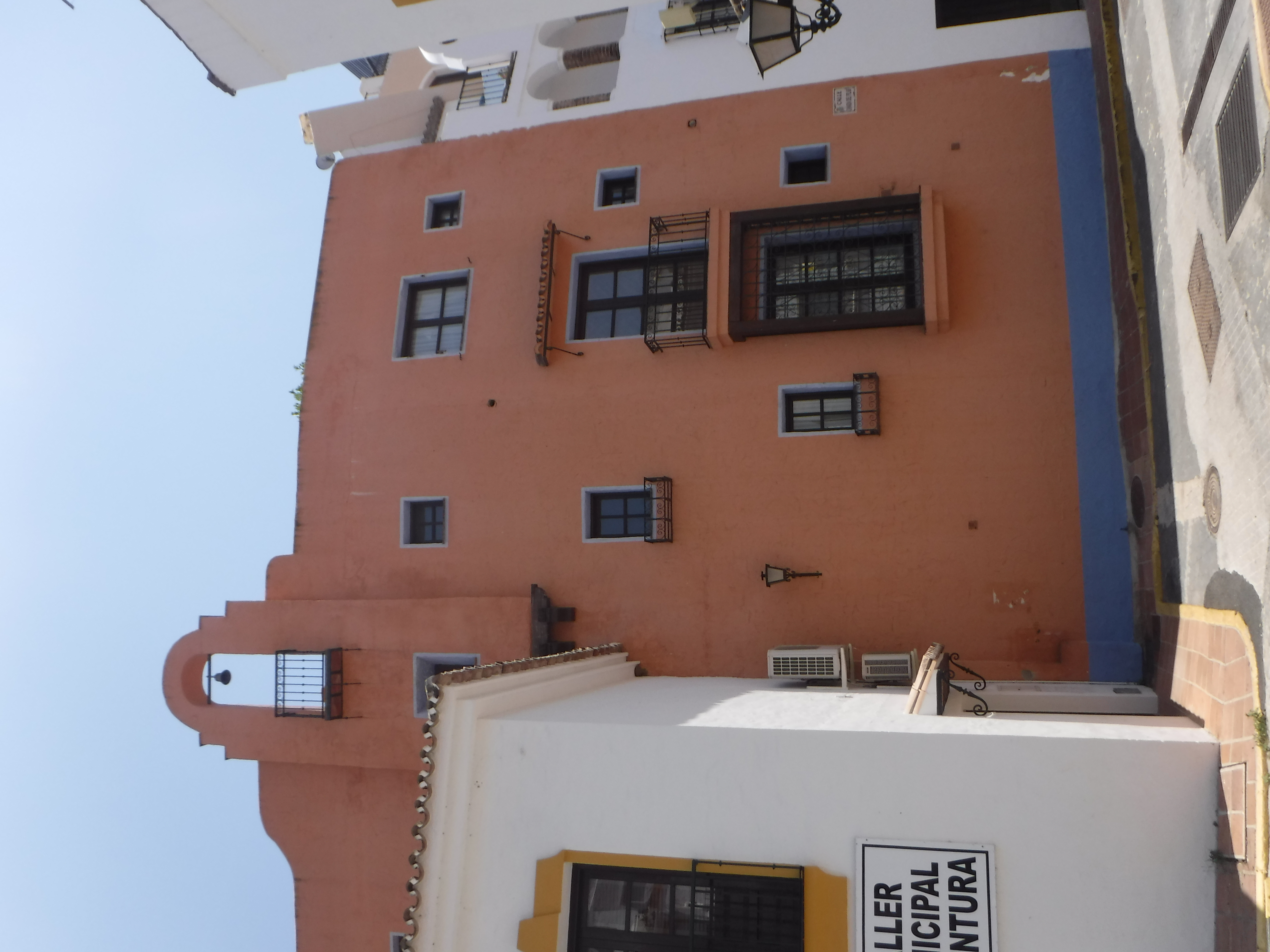 Architectural detail of a building with windows in Benahavis, Spain.